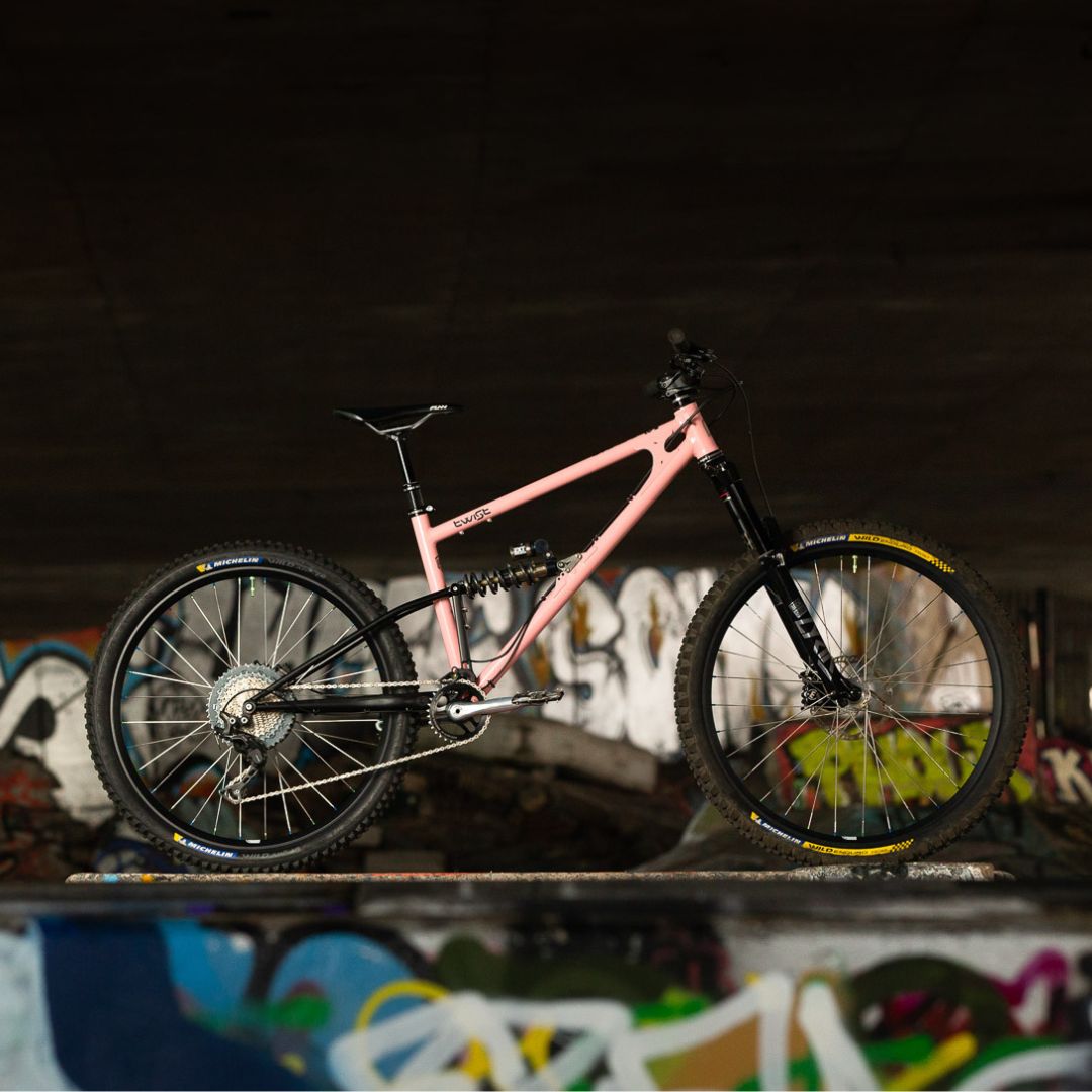 Pink Starling Twist mountain bike in graffiti location