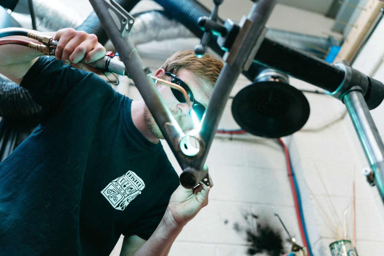 Starling Cycles frame builder working on a frame in workshop