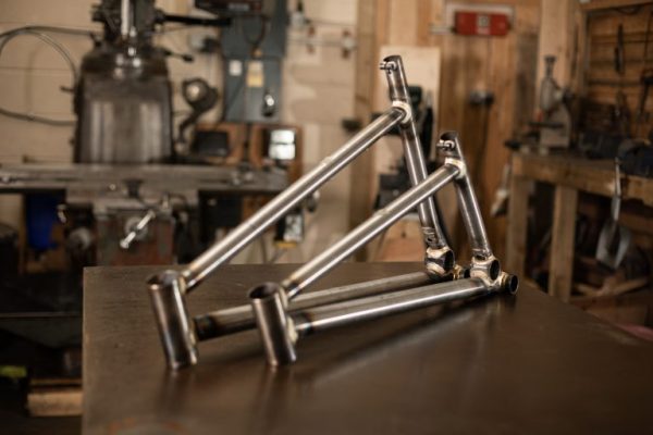 two unfinished steel mountain bikes