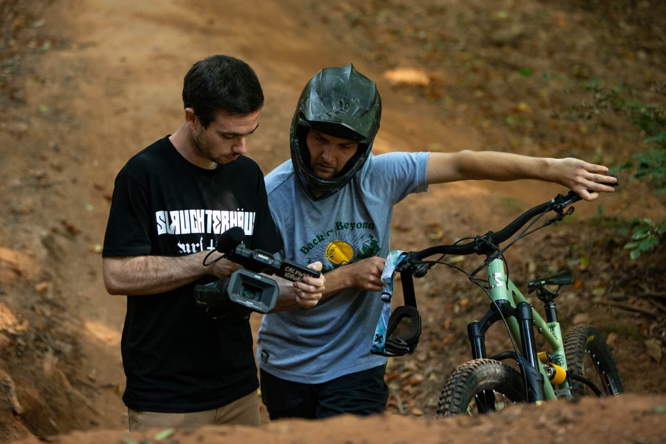 the videographer and rider look at one of the shots