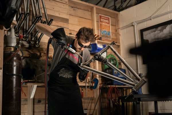 a man welding a starling frame