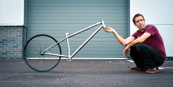 Starling Cycles Roost Frame with Joe kneeling alongside