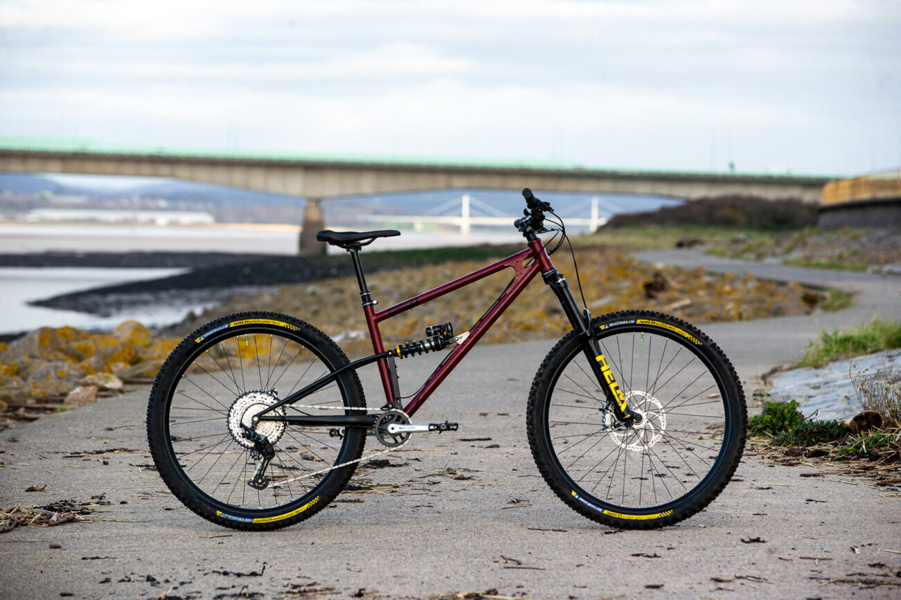 Starling Cycles Mega Murmur on a beach, with Cane Creek Suspension