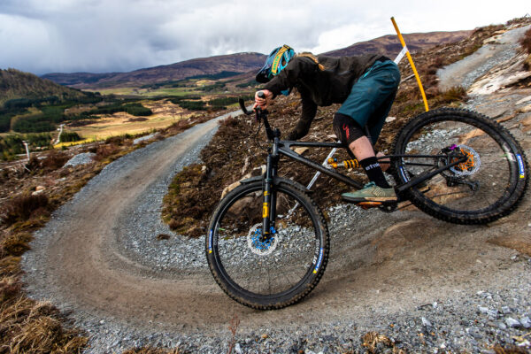 Mountain Bike Rider on Starling cycles mtb riding a corner in mountains